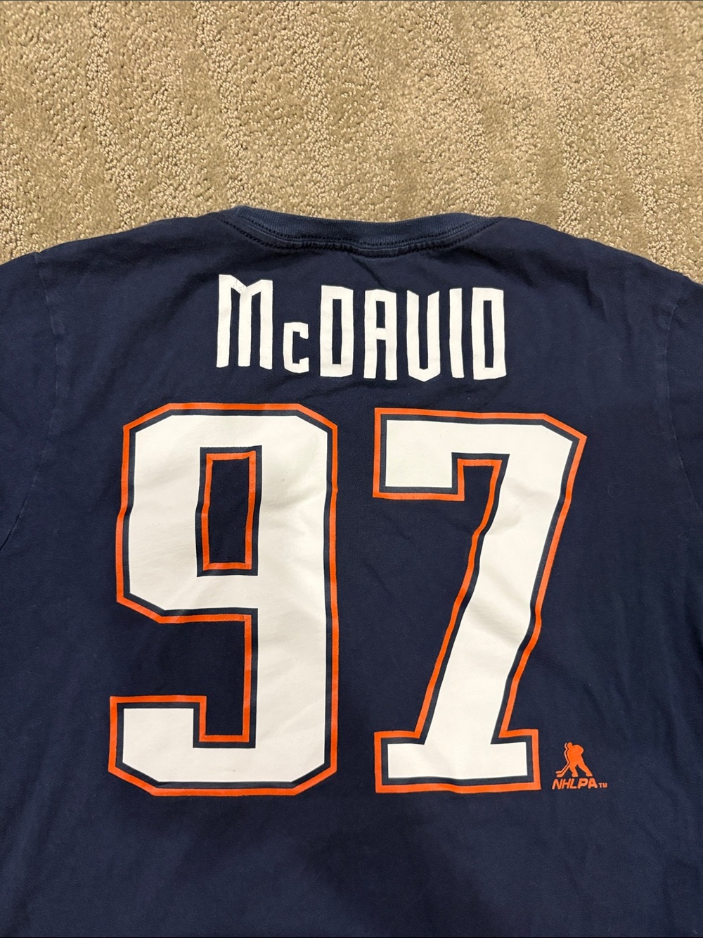 NHL Navy Short Sleeve Tee with Silver and Orange Crest kids size XL